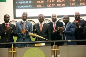 L – R: shows Phillip Isakpa, Editor/Executive Director Publications, BusinessDay Media Limited Ade Bajomo, ED, Market Operations & Technology, NSE Frank Aigbogun, Publisher/CEO, BusinessDay Media Limited and Haruna Jalo-Waziri, ED, Capital Markets, NSE at the Closing Gong Ceremony in commemoration of 15 years anniversary of the Business Daily at the Exchange on Wednesday.