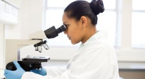 Lab scientist in Cape Town, South Africa; the IMF study finds South Africa has one of the most gender-equal environments in the region (photo: Resolution Productions Blend Images/Newscom)