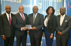 L- R: Mr. Charles Ifedi, Divisional CEO, Consumer Segments, Interswitch Limited; Mr. Mitchell Elegbe, GMD/CEO, Interswitch Limited; Dr. Adesola Adeduntan, MD/CEO, First Bank of Nigeria Limited and Subsidiaries; Mrs. Folashade Femi-Lawal, Head, Digital Banking, First Bank of Nigeria Limited; and Mr. Seyi Oyefeso; Group Executive, Commercial Banking, First Bank of Nigeria Limited at the official recognition of FirstBank’s 100 million monthly transactions milestone at FirstBank Headquarters in Lagos…yesterday  