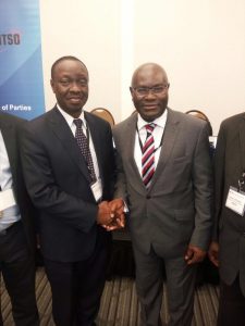 Shola Taylor (right), Secretary-General of CTO congratulating Patick Masambu (left), Director-General of ITSO