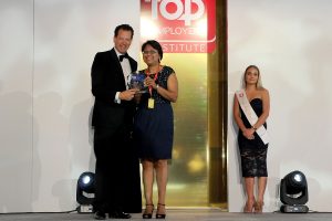 Sonia Calou, HR Generalist for DHL Express SSA Indian Oceans, receiving the Top Employer Africa 2017 certification on behalf of DHL Express Sub Saharan Africa