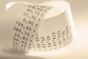 Macro of folded receit paper. Shallow DOF. Sepia tone.